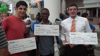 Students receive a scholarship from NobleHour for their volunteer service.